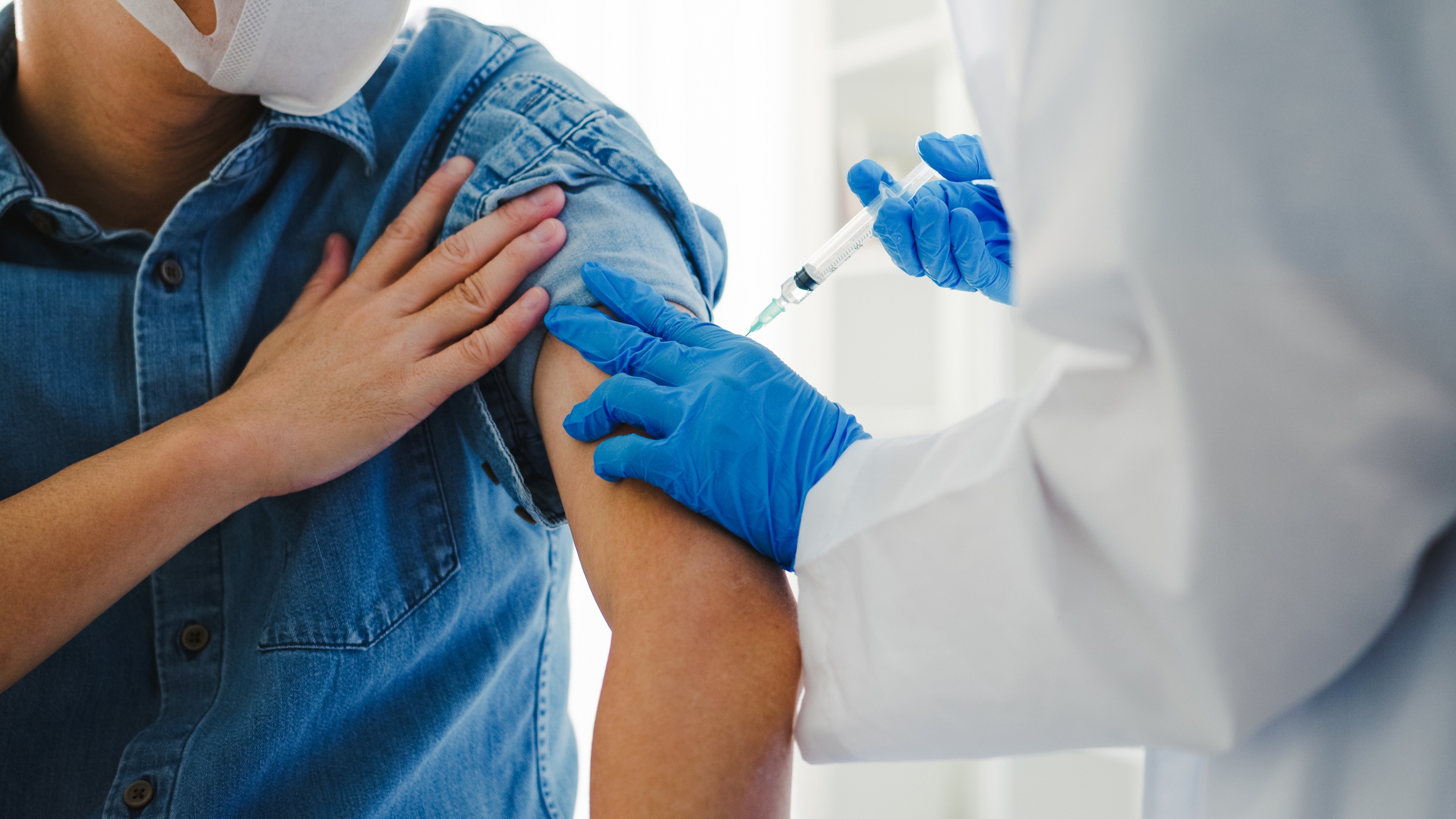 Man receiving full vaccination from CityMD urgent care doctor