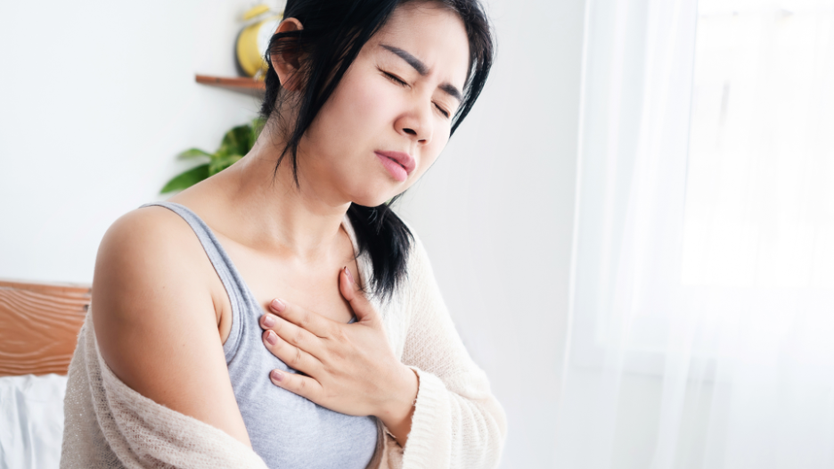 Woman experiencing shortness of breath causes