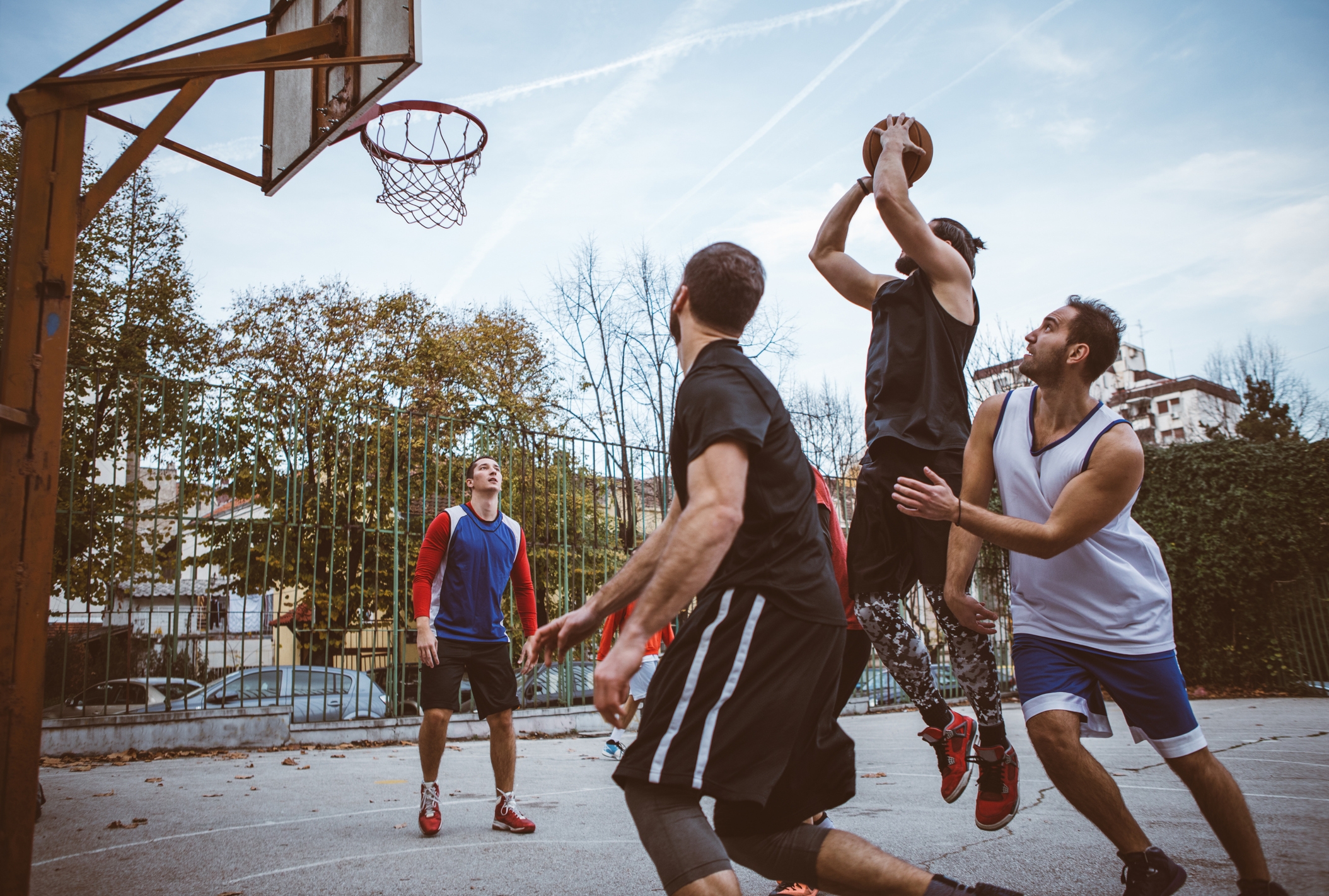 Men playing basketball