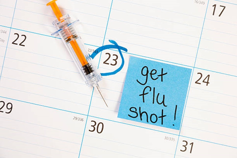 Sticky note on calendar to get flu shot!