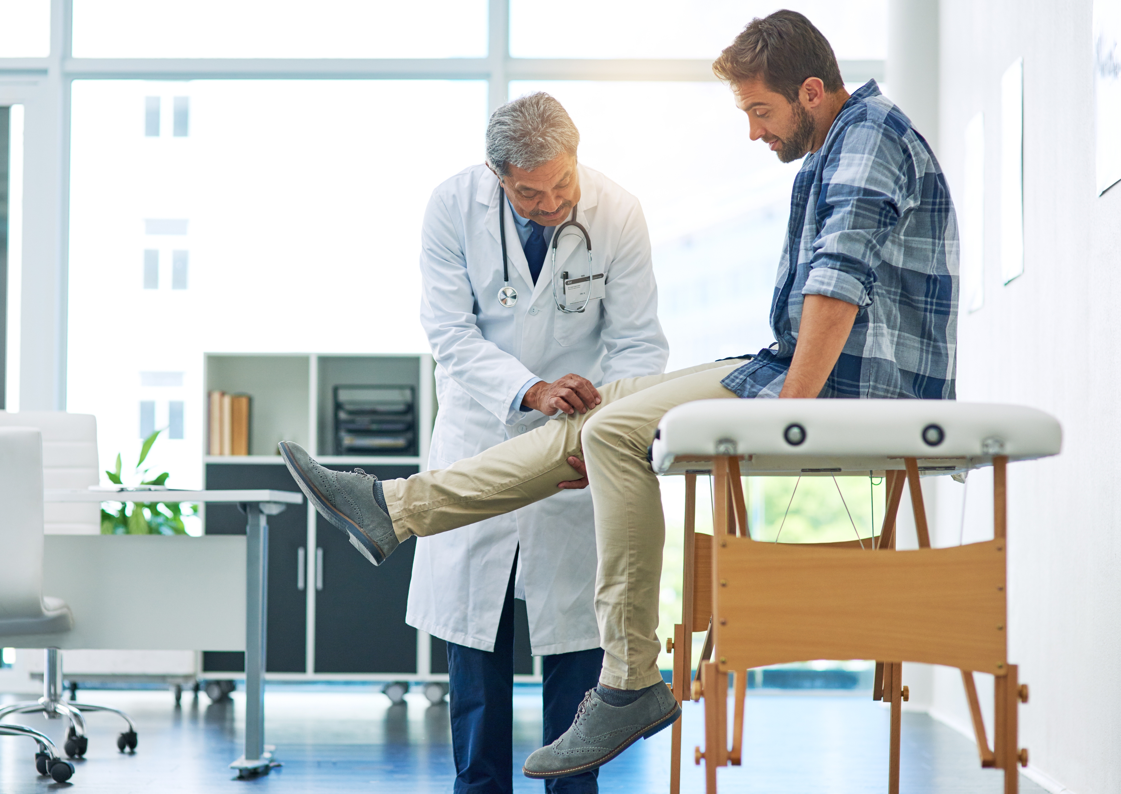 Man getting a physical exam by doctor
