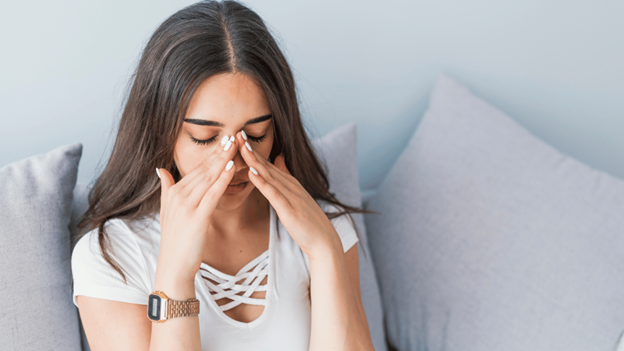 A woman struggling with a contagious sinus infection
