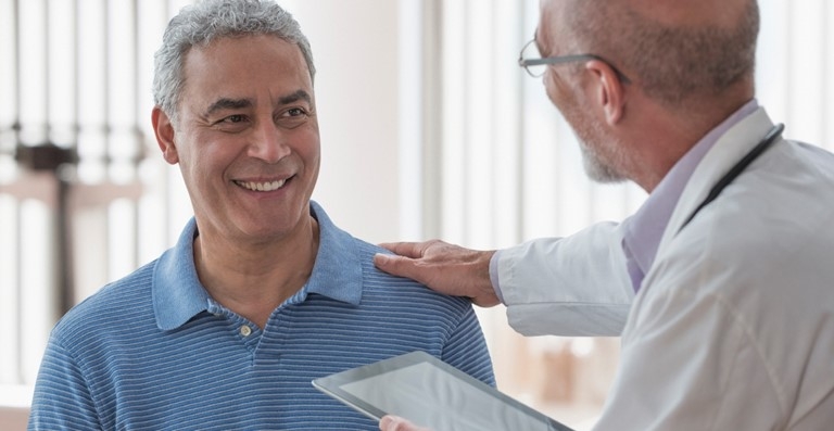Doctor with patient in exam room