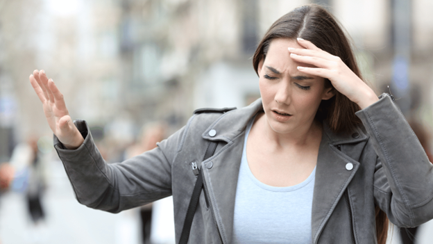 Woman feeling weak and shaky out in public, possibly due to low blood sugar