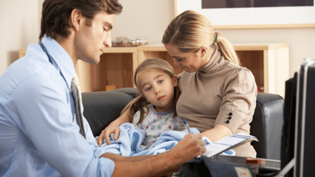 CityMD doctor examining a child with early hand, foot, and mouth disease symptoms like fever