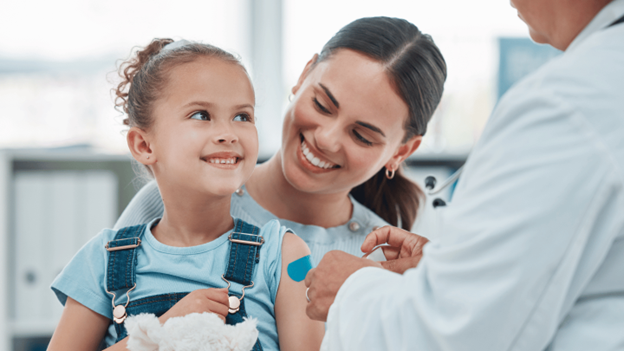 CityMD provider giving flu vaccine to a young patient for annual flu shot protection