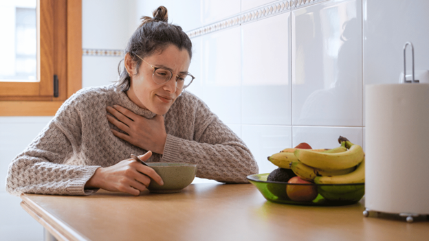 Woman eating a bland diet after throwing up